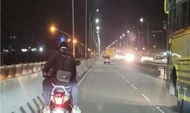 Viral: Man works on laptop while riding pillion, image divides internet