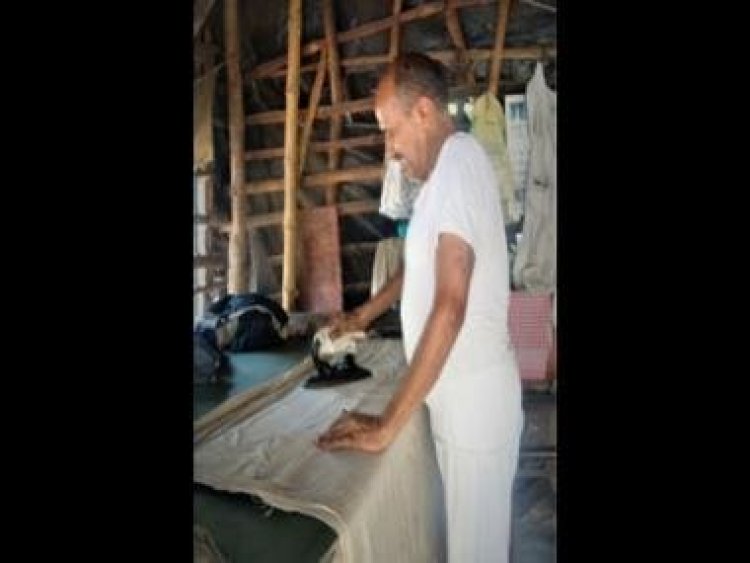 Watch: Washerman sprays water with mouth to iron clothes, leaves internet disgusted