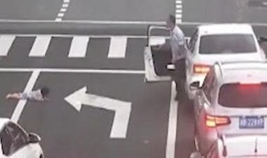 Watch: Child falls out of car's window on busy road in China, motorists rush to rescue