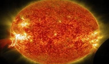 What are solar flares that can reach temperatures up to 100 million degrees?
