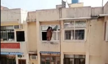 Viral video: Woman risks life by climbing to railings to clean windows, internet reacts