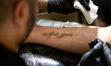 'In god's hands': Catholics assemble in numbers at Austrian church for 'free' tattoo