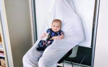 Dad's smart trick to make toddler's passport photos possible wins over internet