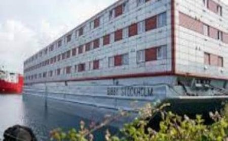 UK moves asylum seekers to a residential barge on southern coast