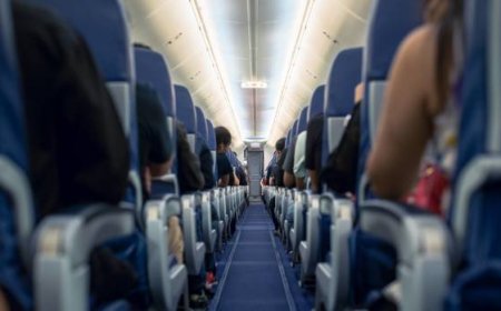 Airline travelers react as men fly first class with wives in coach