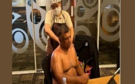 Top(less) Perks: AirAsia CEO sits in board meet getting a massage; trolled on social media