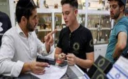 Stunned at Hamas killings, Israelis scramble to buy guns with government’s blessing