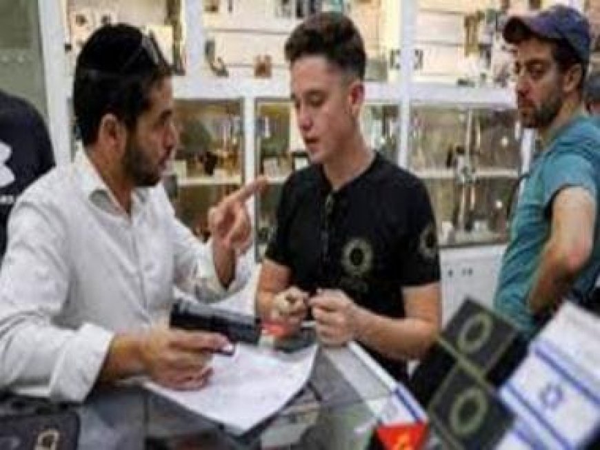 Stunned at Hamas killings, Israelis scramble to buy guns with government’s blessing